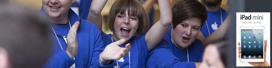 every-email-is-sacred A banner with a crowd of people wearing blue Apple store uniforms cheering and clapping, with a cutout of a hand holding an iPad in the corner, under the words "iPad mini".