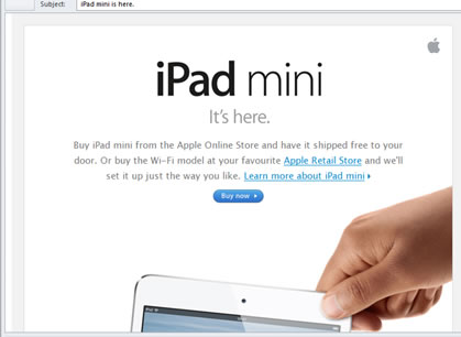 Ipad A screenshot of a webpage advertising an iPad mini, with a paragraph of indiscernible text above an image of a hand holding a white iPad by its corner.