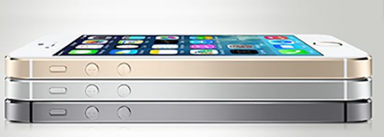 iPhones One grey, one silver and one rose gold iPhone stacked on top of each other.