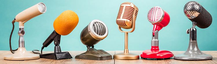 Reviews blog A row of six retro-looking microphones.