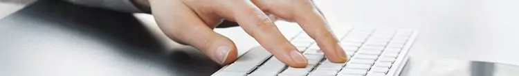 Student email signature template A close up of hands typing at a keyboard.