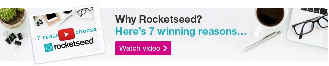 Why Rocketseed A Rocketseed email banner with the message "Why Rocketseed? Here's 7 winning reasons..." above a Watch video button, on a bird's-eye-view photograph of a desk with various tech and stationary on it.